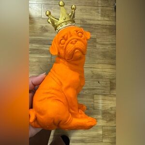 ORANGE RESIN PUG STATUE WITH CROWN